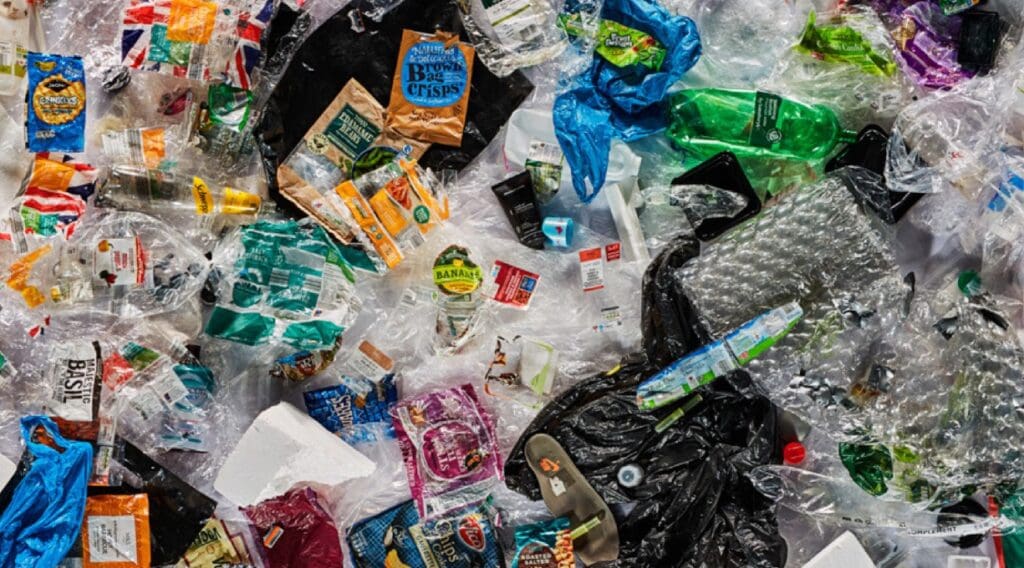 pile of plastic rubbish - bottles, wrappers, containers.