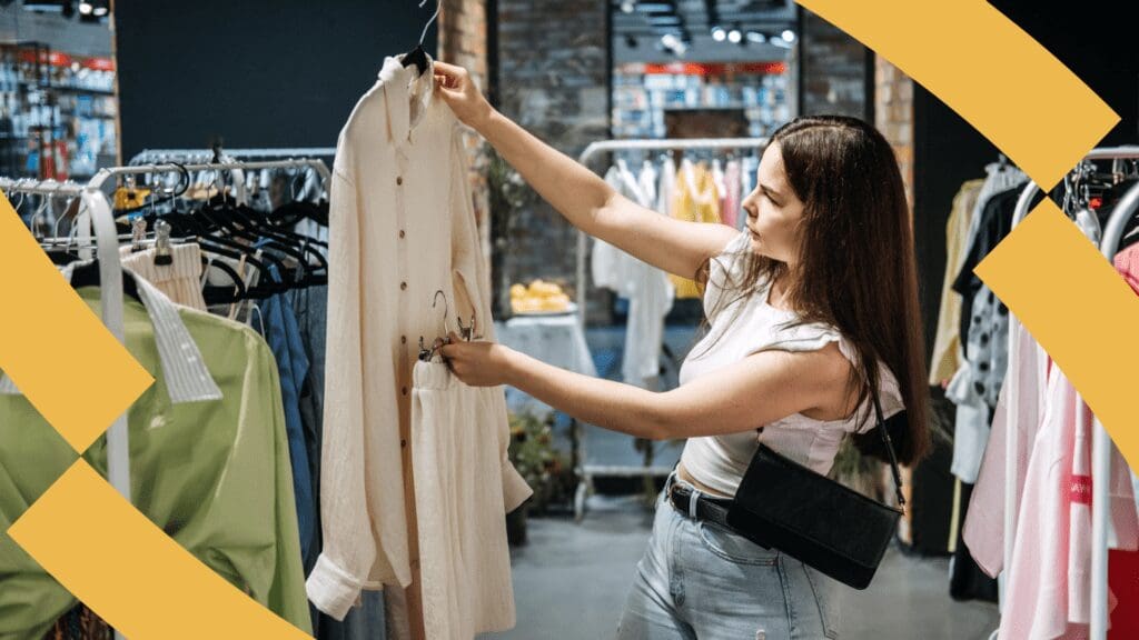 Fashion - woman holds an item of clothing picked from a rail