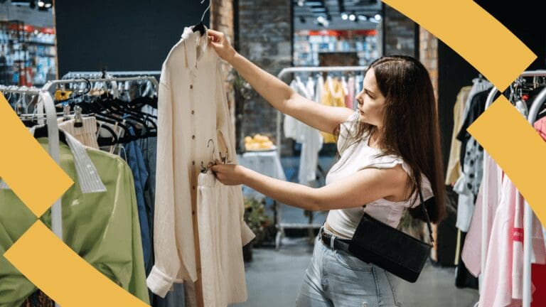 Fashion - woman holds an item of clothing picked from a rail