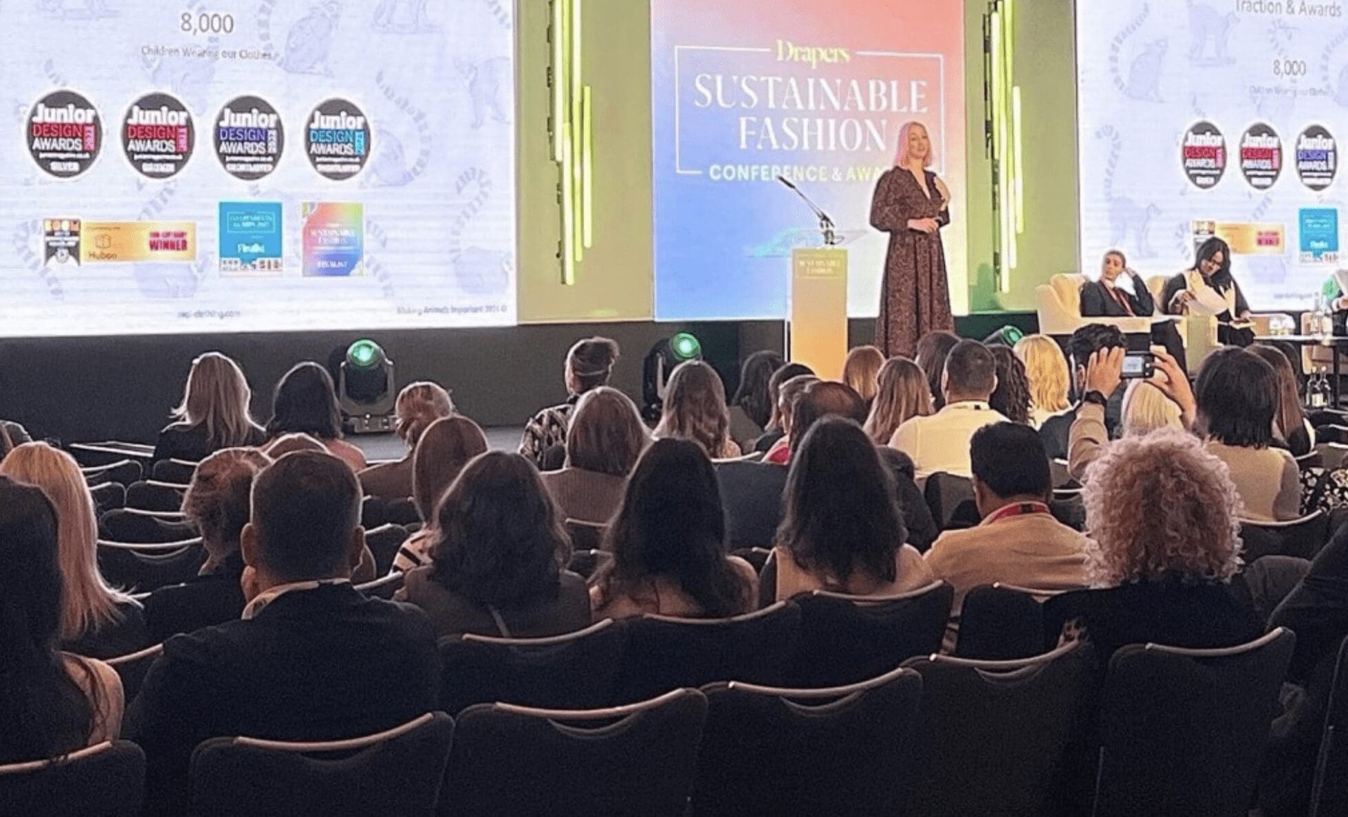 Tina Salt, founder of MAI Clothing stands on stage at the Drapers Sustainable Fashion Conference and Awards