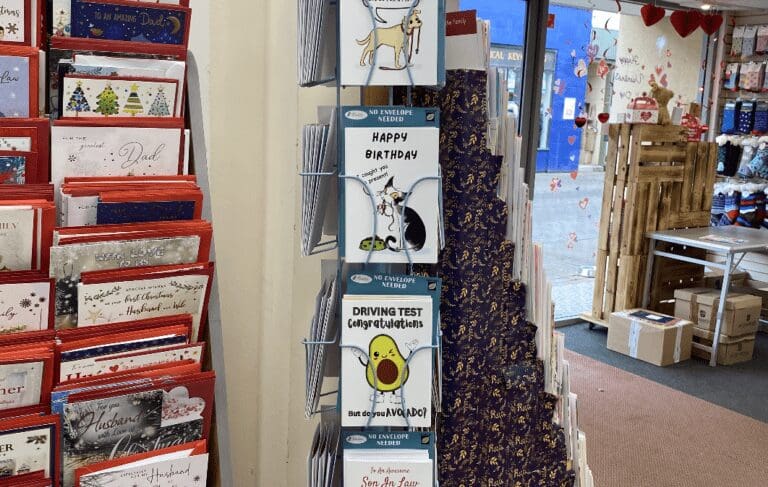 A POS display unit showcases Bare Cards' collection inside a greeting cards shop.