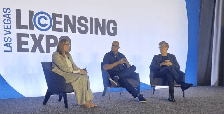 Helena sits on stage with Yalmaz Siddiqui from Disney and Jakob from LEGO.