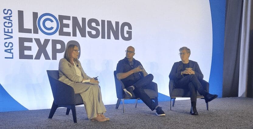 Helena sits on stage with Yalmaz Siddiqui from Disney and Jakob from LEGO.