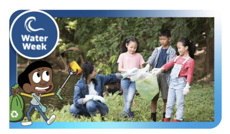 kids holding fishing nets as they clean up their local waterways together.