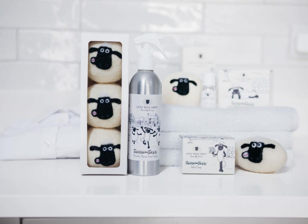 Little Beau Sheep collaboration with Aardman's Shaun the Sheep products, including sheep-shaped dryer balls and spray bottle.
