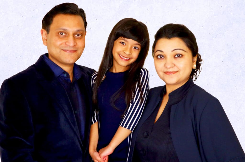 A family portrait of three individuals
