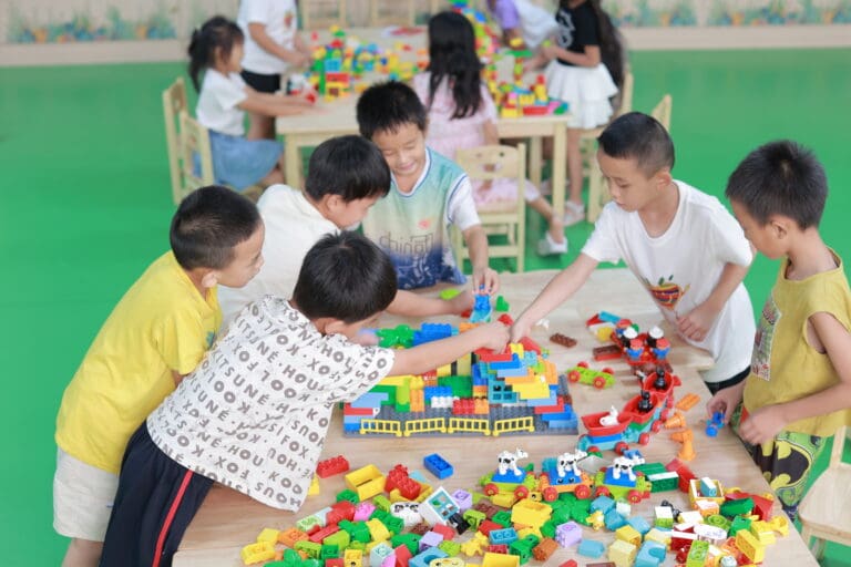 A group of children playing around a table