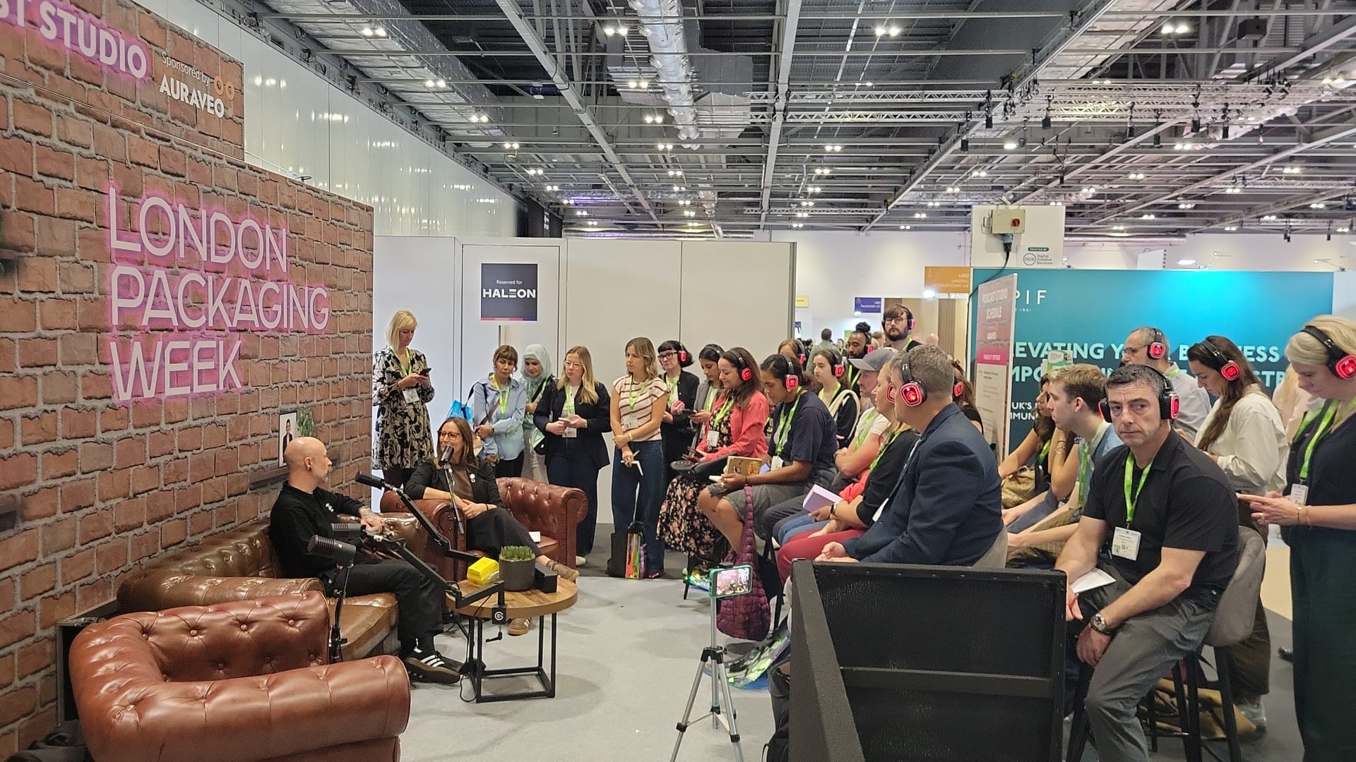 Steve from Lush and Helena from POC on the podcast stage with an audience watching